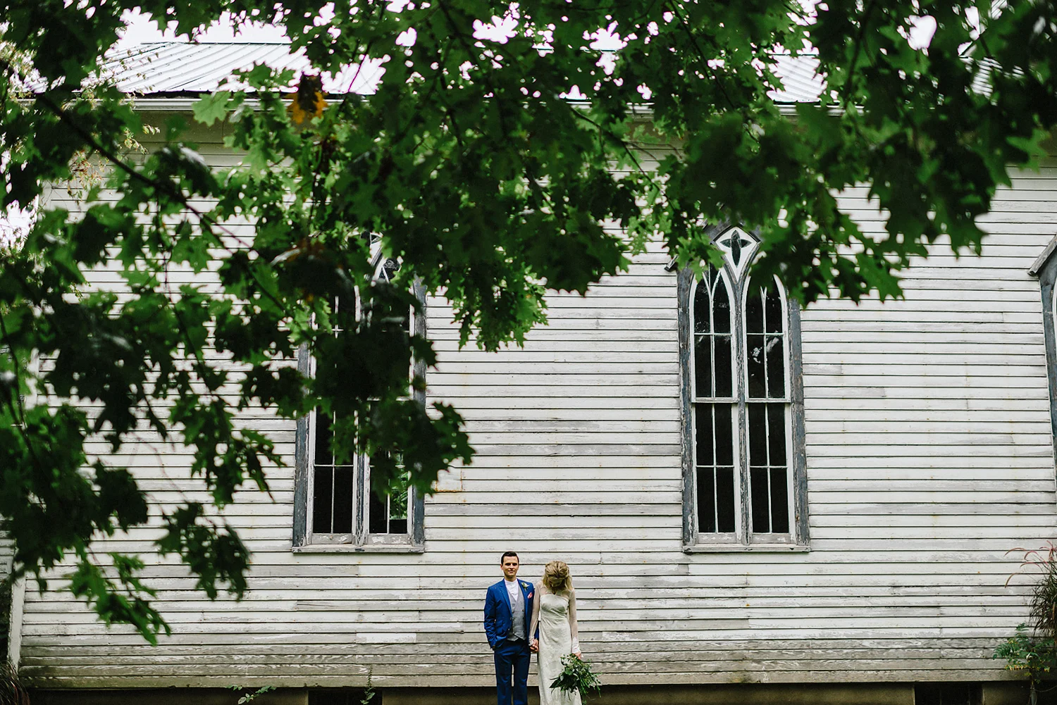 Best-Moody-Documentary-Wedding-Photography-Photojournalism-Vintage-Small-Town-Chapel-Wedding-Toronto-Ontario_Bridal-Portraits-Bride-and-Groom-Outside-Venue.jpg