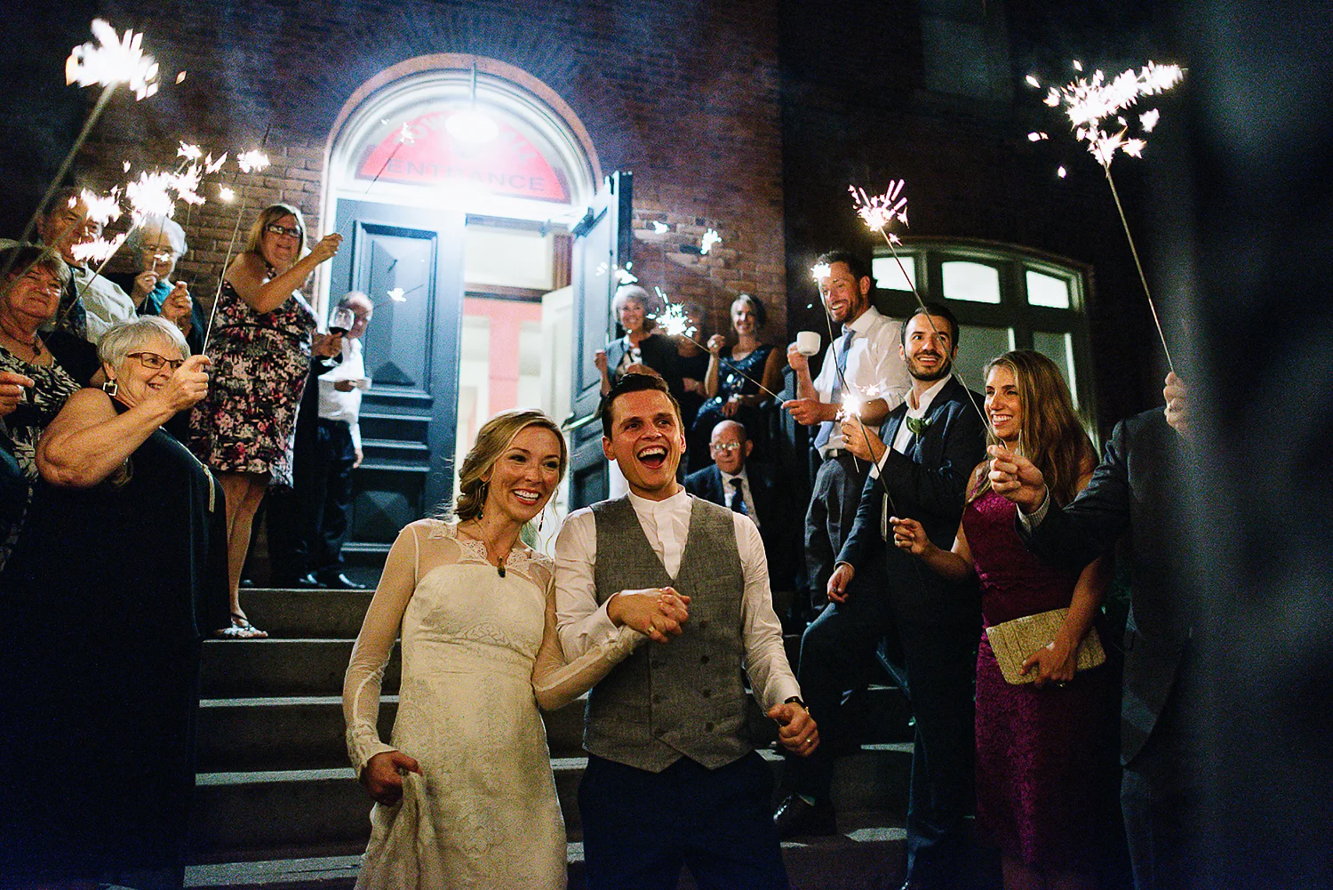 Best-Moody-Documentary-Wedding-Photography-Photojournalism-Vintage-Small-Town-Chapel-Wedding-Toronto-Ontario_Reception-Venue-bride-&-groom-sparkler-exit.jpg
