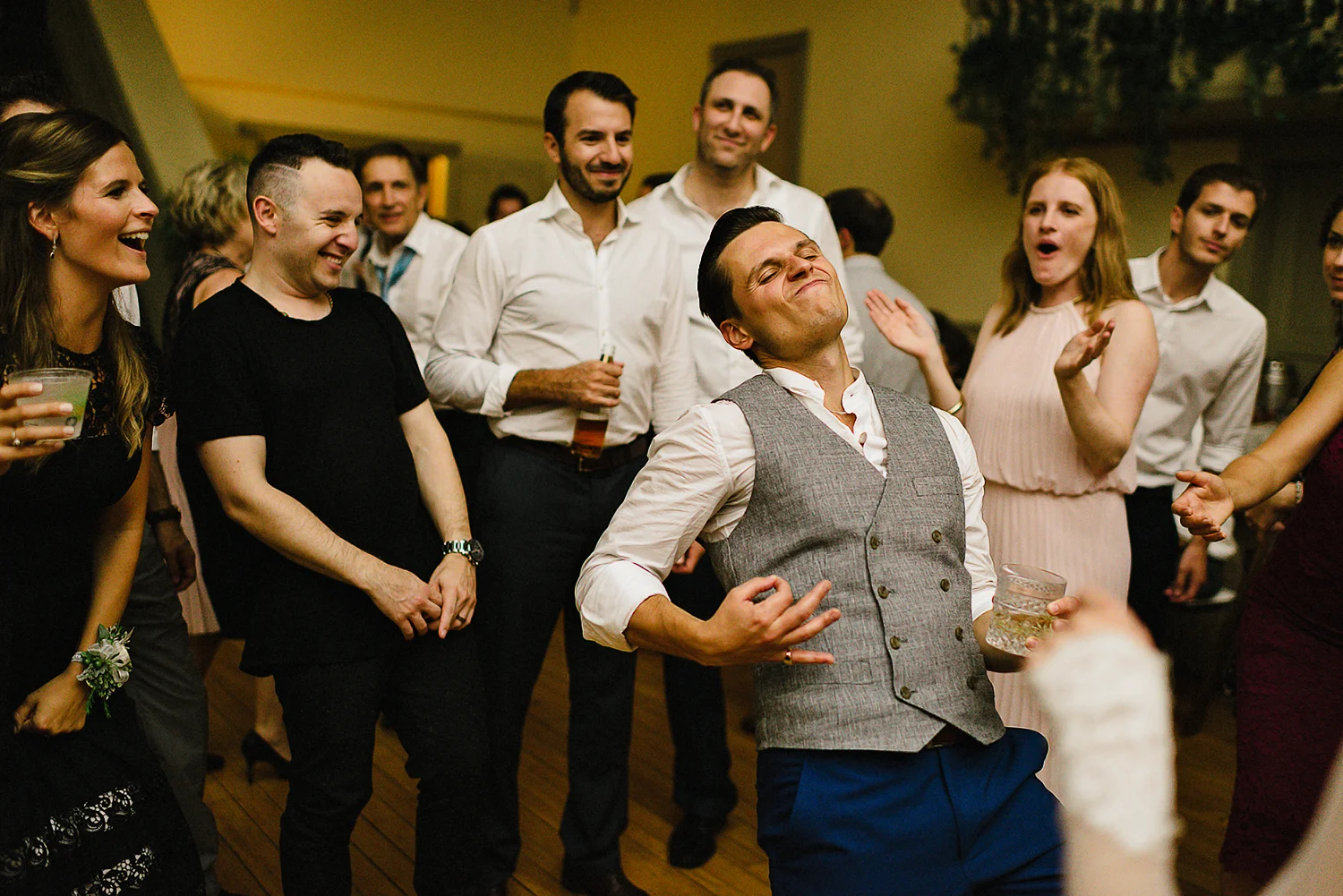 Best-Moody-Documentary-Wedding-Photography-Photojournalism-Vintage-Small-Town-Chapel-Wedding-Toronto-Ontario_Reception-funny-groom-air-guitar.jpg