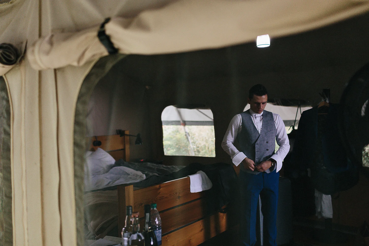 Best-Moody-Documentary-Wedding-Photography-Vintage-Small-Town-Chapel-Wedding-Toronto-Ontario_Candid_Groom-Getting-ready-at-Campsite--inside-tent.jpg