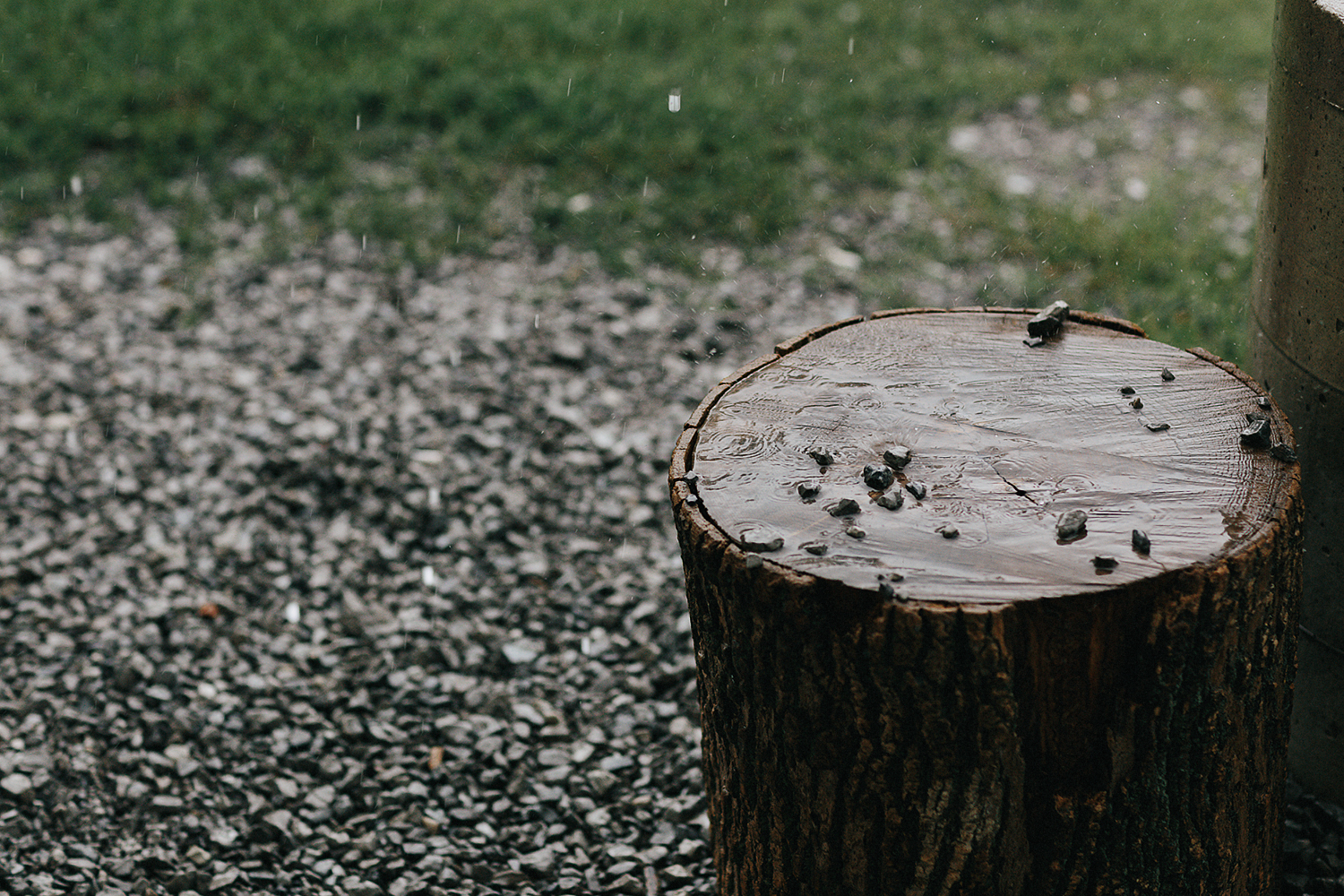 Best-Moody-Documentary-Wedding-Photography-Vintage-Small-Town-Chapel-Wedding-Toronto-Ontario_Candid_Groom-Getting-ready-at-Campsite-Venue--rain-stump-details.jpg