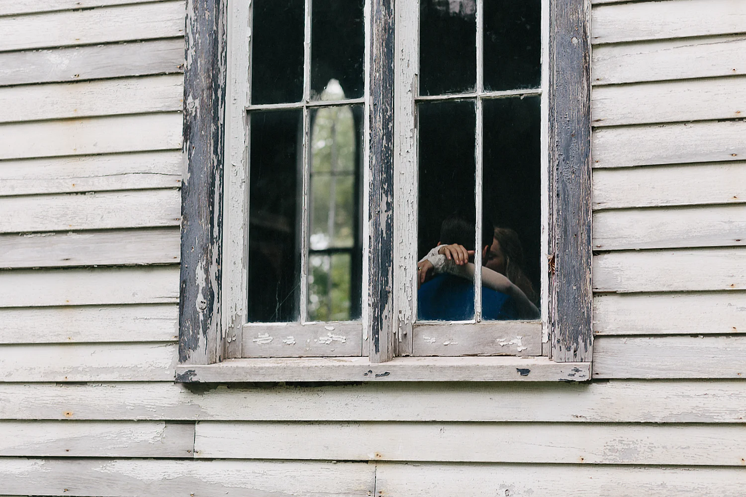 Best-Moody-Documentary-Wedding-Photography-Photojournalism-Vintage-Small-Town-Chapel-Wedding-Toronto-Ontario_Bridal-Portraits-Bride-and-groom-quiet-moment-in-chapel-candid-window.jpg