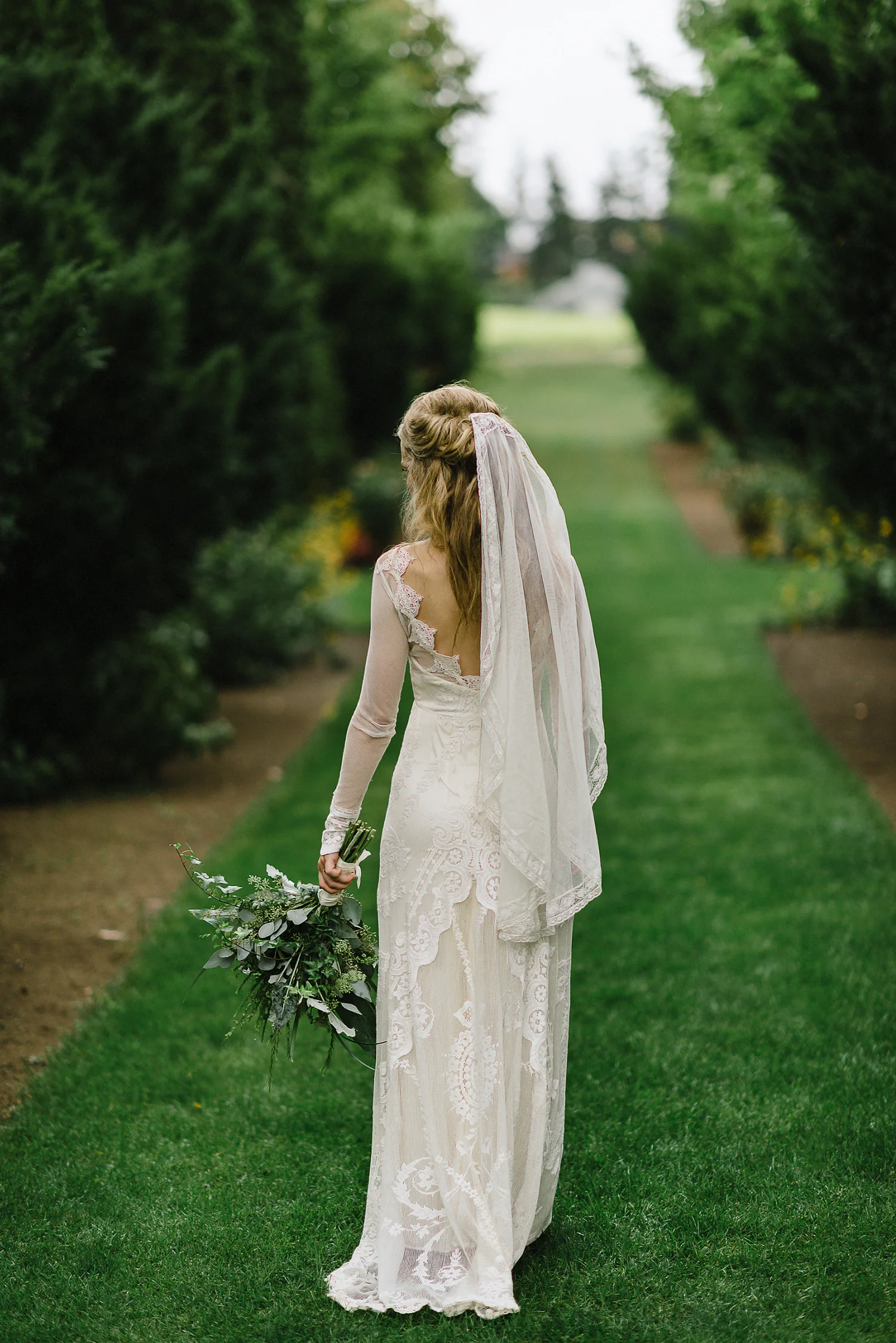 Vertical-Best-Moody-Documentary-Wedding-Photography-Photojournalism-Vintage-Small-Town-Chapel-Wedding-Toronto-Ontario_Bride-Portrait-in-Garden.jpg