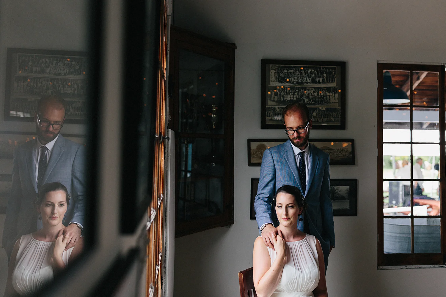 Toronto-Island-Wedding-Toronto-Best-Film-Wedding-Photographers-3b-photography-analog-photography-wards-island-clubhouse-details-old-photographs-vintage-rustic-venue-bride-and-groom-formal-portrait-moody-romantic-film-reflection.jpg