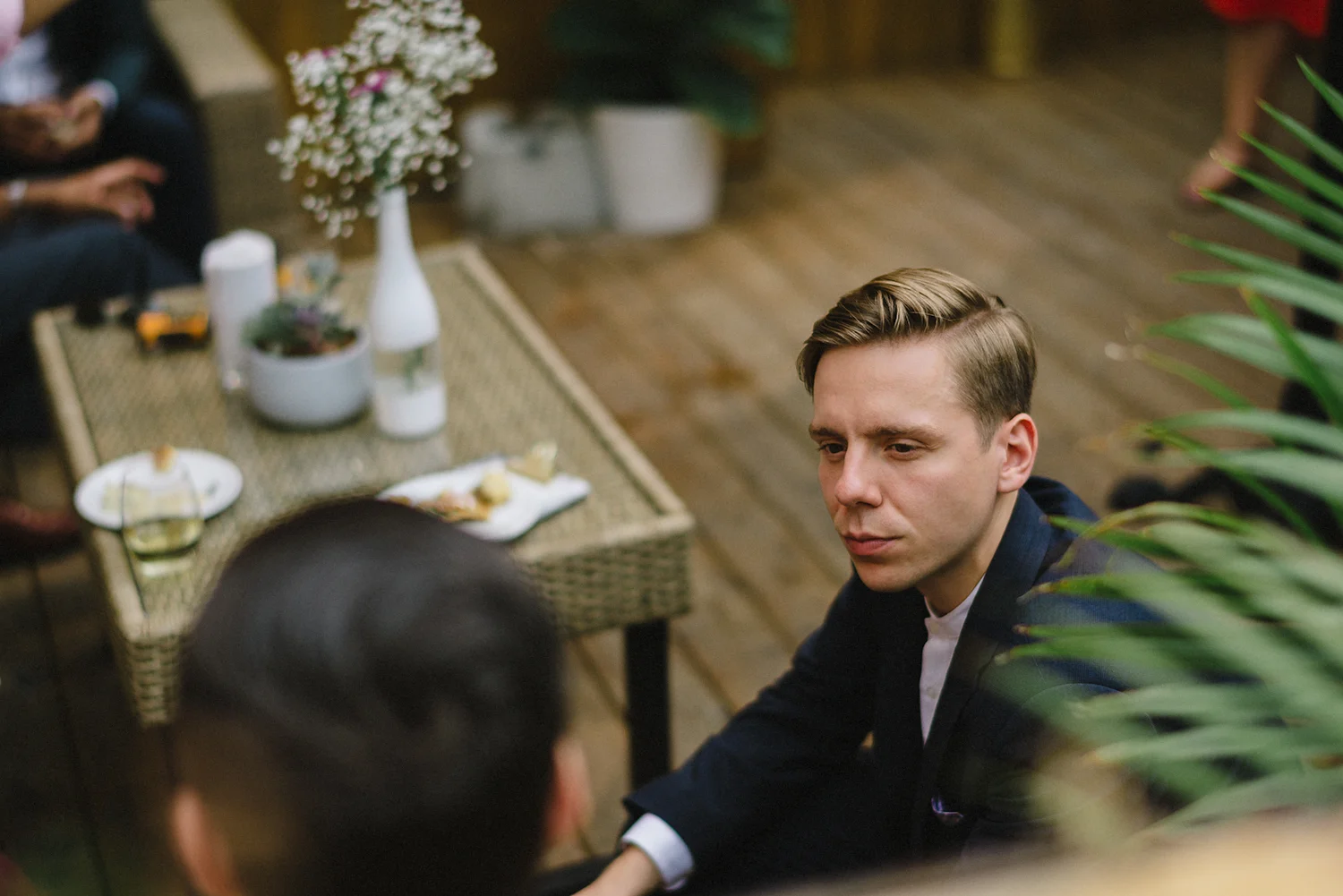 film-analog-photography-toronto-film-wedding-photographers-alternative-reception-bar-pray-tell-cocktail-hour-reception-on-the-front-patio-chilling-mingling-groom.jpg