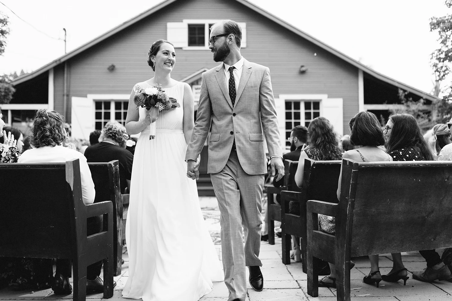 Toronto-Island-Wedding-Toronto-Best-Film-Wedding-Photographers-3b-photography-analog-photography-wards-island-clubhouse-junebug-weddings-vintage-venue-reception-candid-documentary-bride-and-groom-just-married-recessional-smiling-bw.jpg
