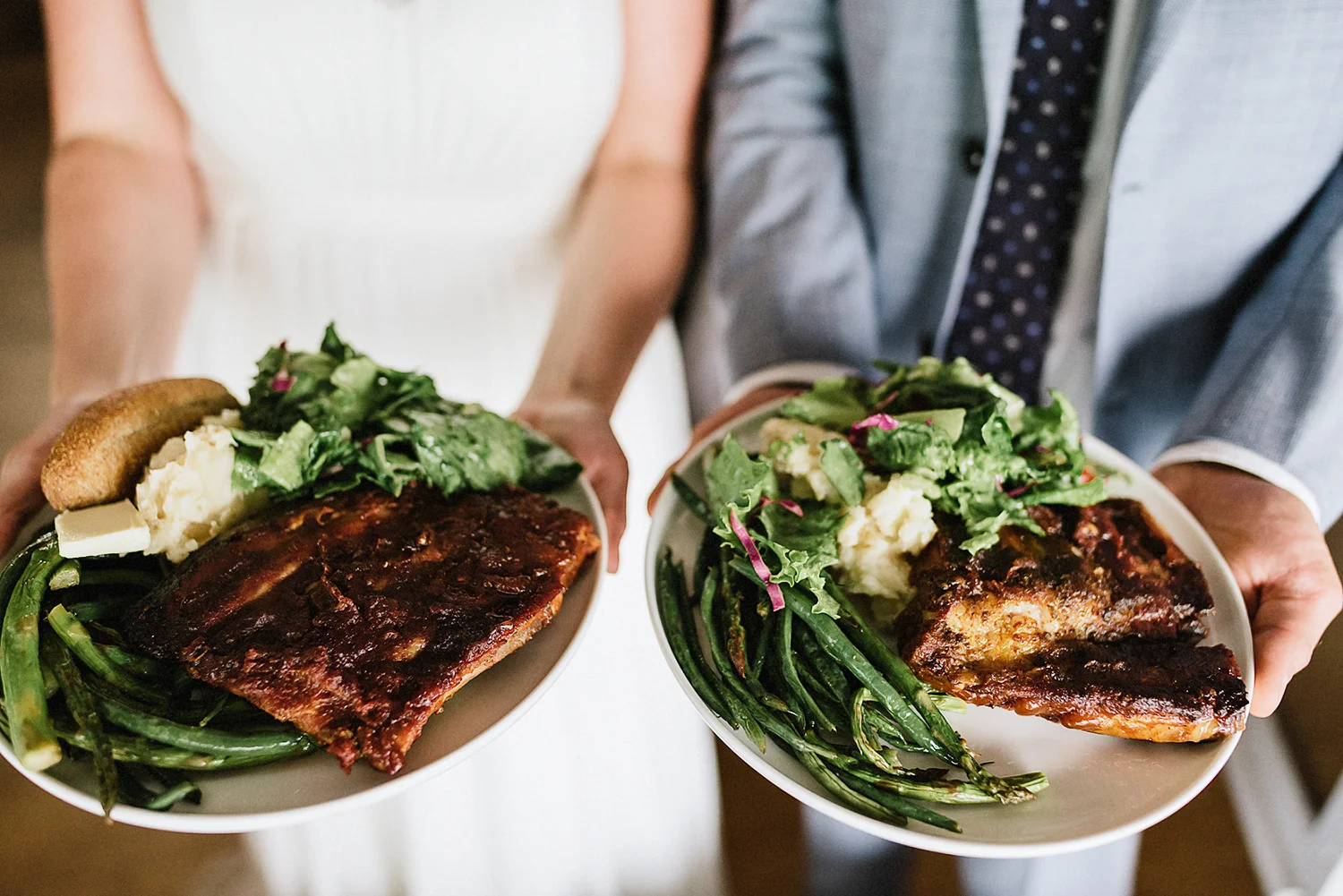 Best-Film-Wedding-Photographers-3b-photography-analog-photography-wards-island-clubhouse-junebug-weddings-vintage-venue-reception-guests-dancing-candid-moments-memories-Bride-and-Groom-Shwoing-BBQ-Dinner.jpg