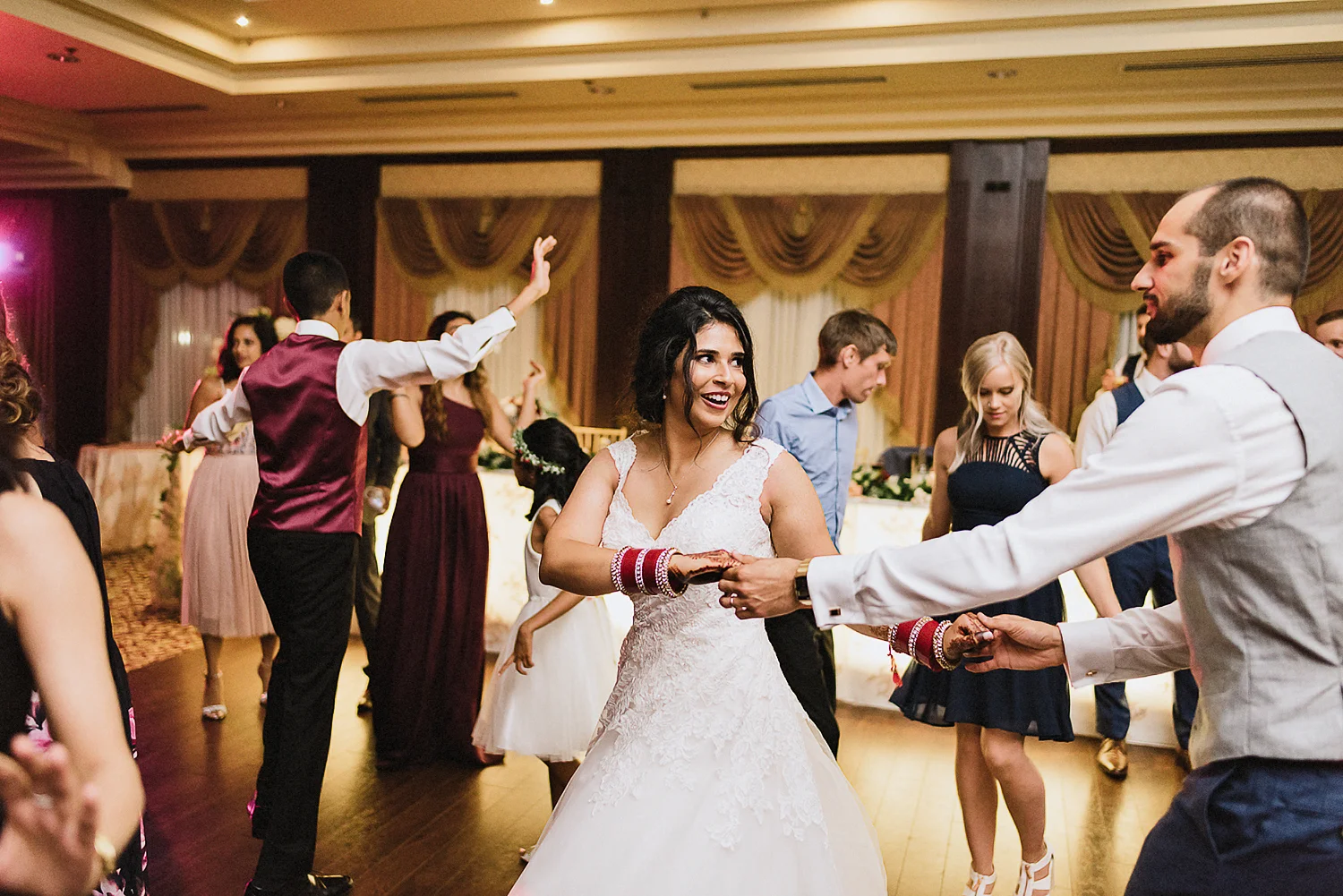 Toronto-Photojournalism-wedding-photographers-3B-Photography-Candid-Documentary-Film-Photography-Analog-Ontario-Extremely-Fun-party-photos-bride-dancing-with-her-groom.jpg