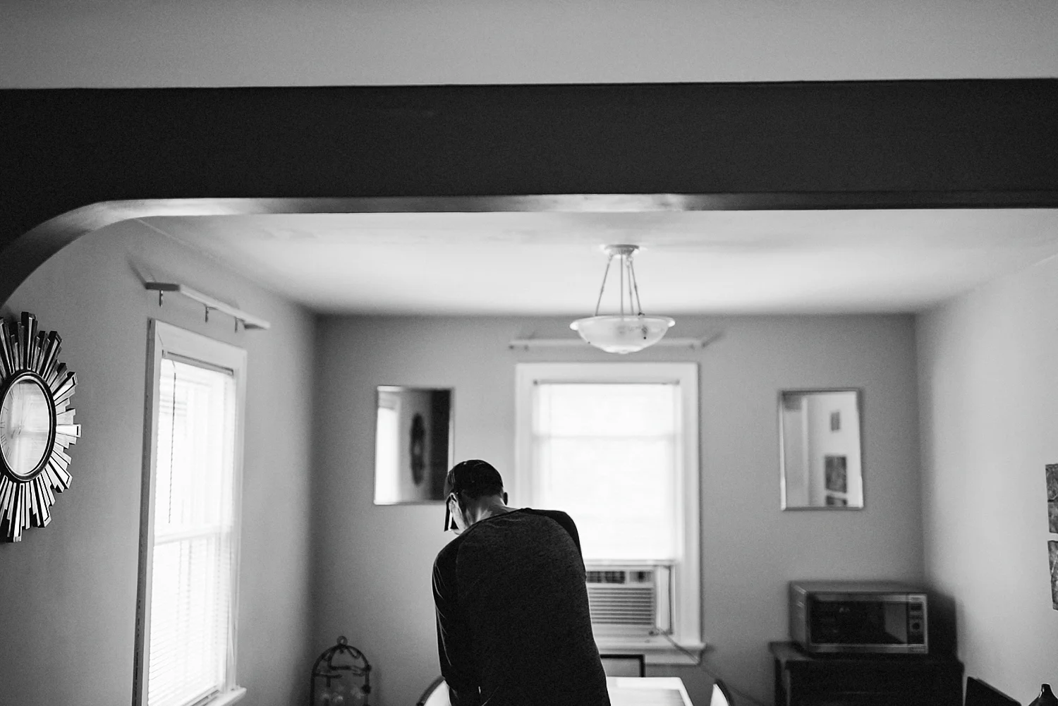 Toronto-Wedding-Photographers-with-natural-photojournalistic-documentary-style-3b-photo-Niagara-on-the-Lake-Wedding-Getting-REady-in-Port-Dalhousie-Groom-ironing-clothes.jpg