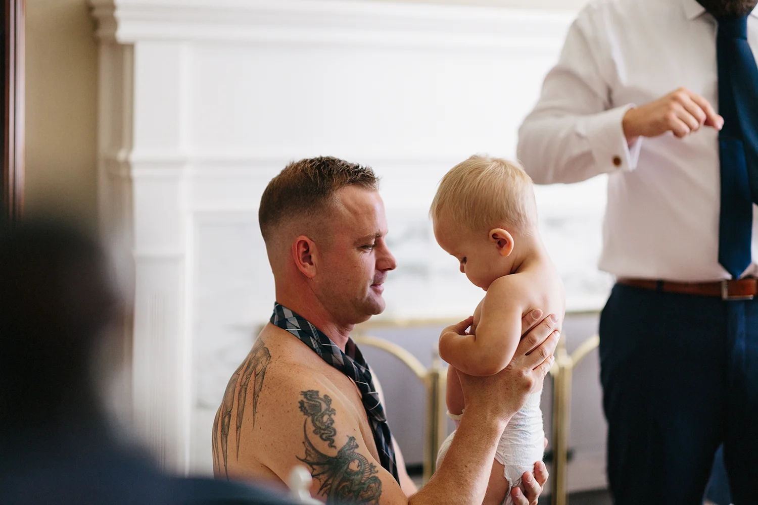 Photojournalistic-Wedding-Photographers-in-Toronto-Candid-Natural-Dowswell-Barn-Wedding-Rustic-GTA-Muskoka-Farm-Groom-getting-ready-blue-suit-tying-tie-with-son.jpg