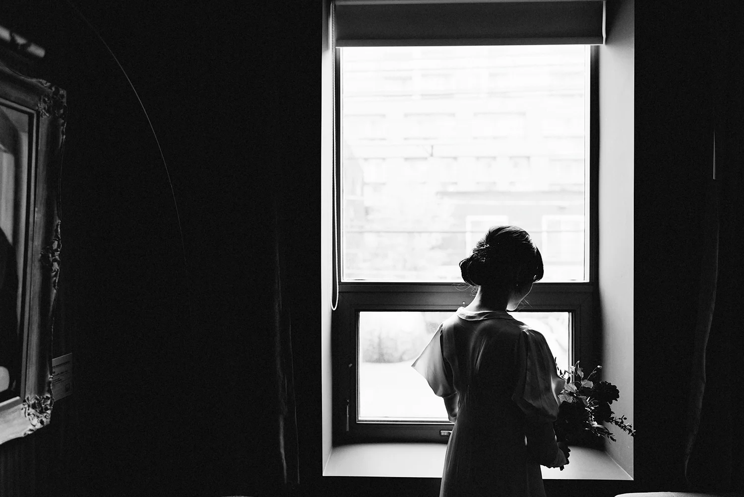 bw-bride-in-vintage-wedding-dress-portraits-by-window-moody-editorial-Toronto-Elopement-at-the-Drake-Hotel-pop-up-Torontos-Best-wedding-photographers-candid-documentary-photojournalistic.jpg