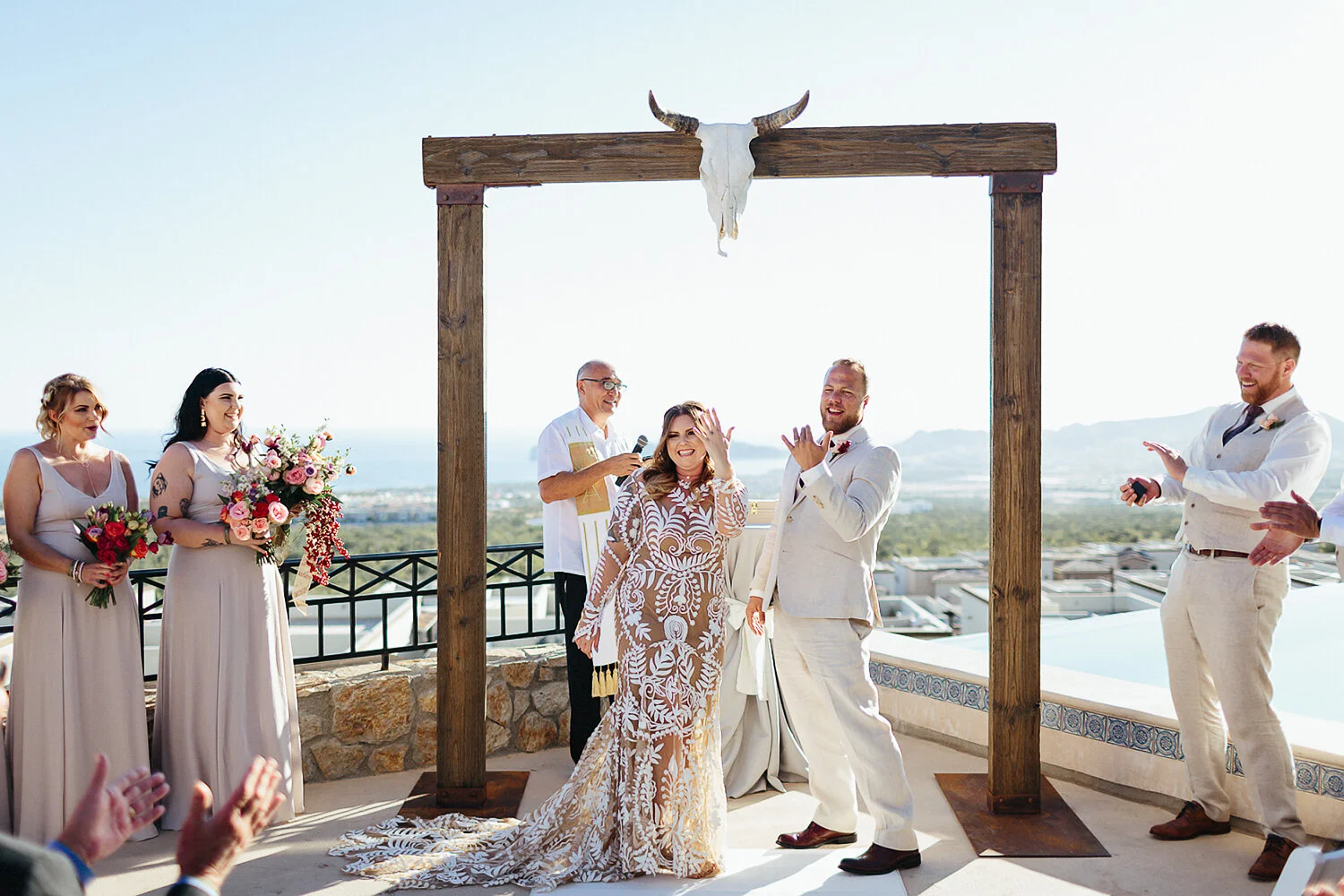 409-cabo-san-lucas-wedding-travelling-destination-wedding-photographer-toronto-wedding-photographers-3b-photography-hipster-trendy-documentary-style-mexico-wedding-ceremony-bride-and-groom-vows-ocean-view-cabo-showing-off-rings-funny.JPG