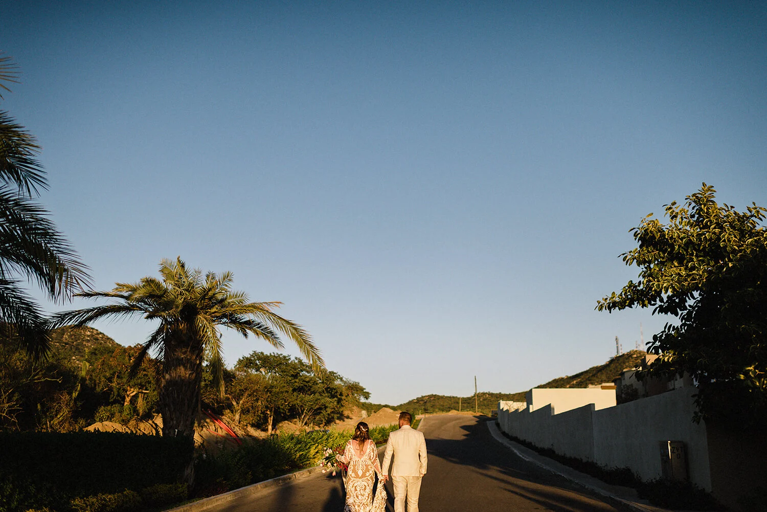 418-destination-wedding-cabo-san-lucas-ventanas-private-residence-alternative-toronto-wedding-photographer-documentary-photojournalistic-portraits-bride-and-groom-portraits-walking-away-sunset-golden-hour.JPG