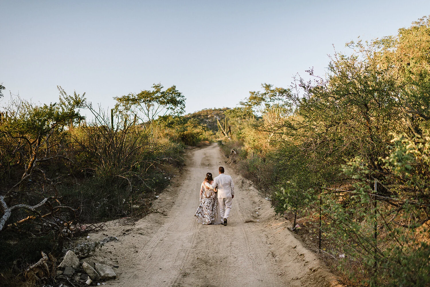 419-destination-wedding-cabo-san-lucas-ventanas-private-residence-alternative-toronto-wedding-photographer-documentary-photojournalistic-portraits-bride-and-groom-portraits-walking-away-sunset-desert.JPG