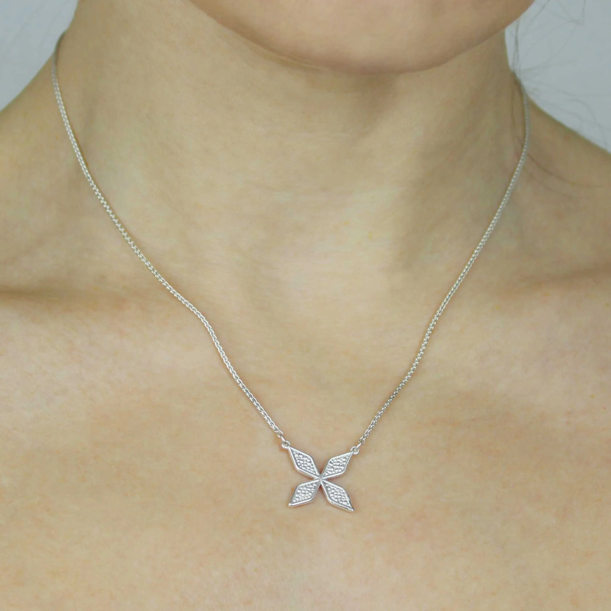 Vera cross pendant silver head.jpg