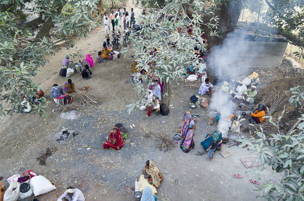  Families from neighbouring tribes sleep under a tree whilst waiting for patients to be operated on. At night temperatures dropped to 1/2 C so children would huddle around fires.&nbsp;  In the morning the smell of home brewed chair swept the entire c