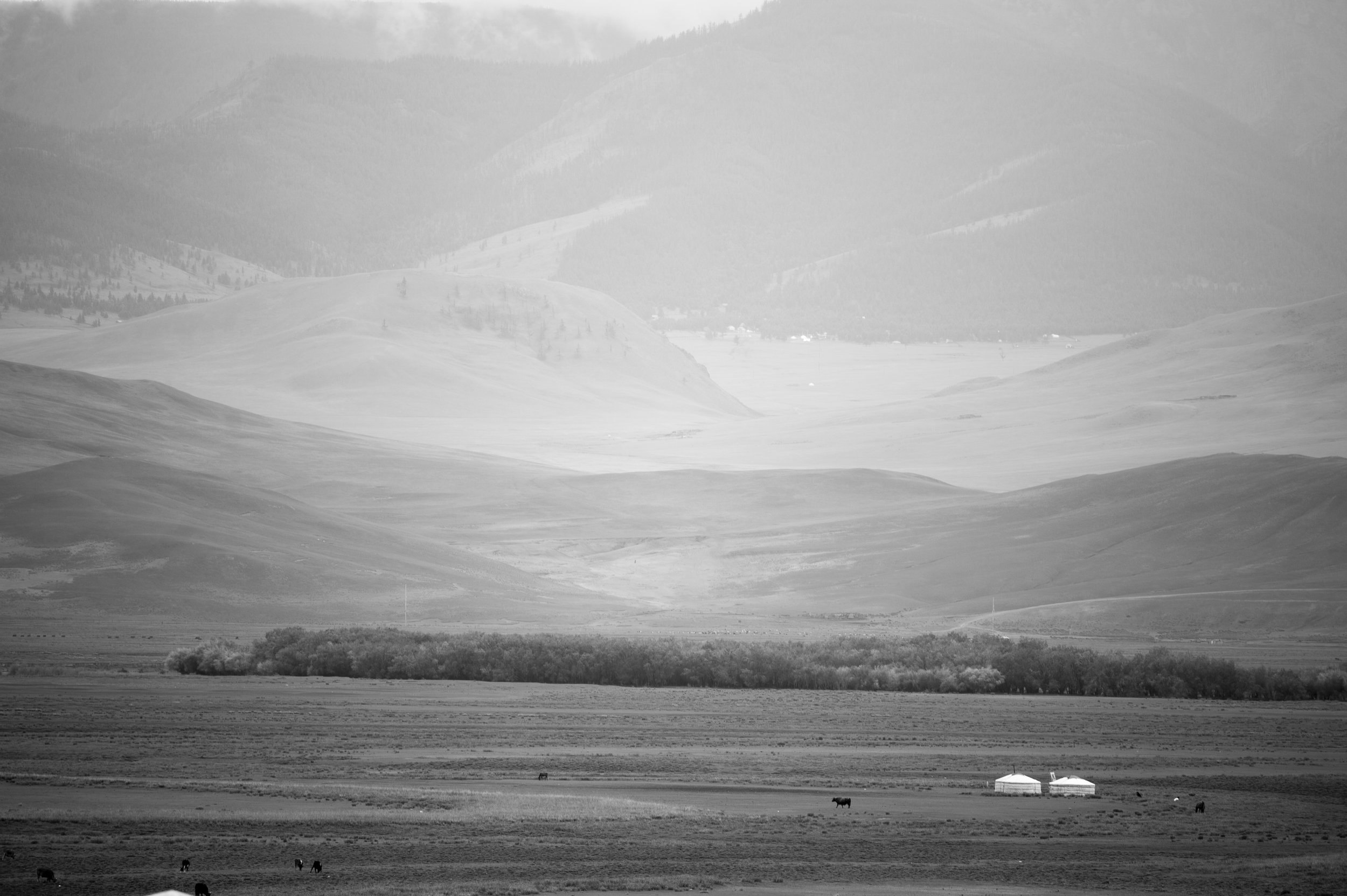 Moron, Mongolia The view into the wilderness from the hospital window. The thick walls built during Soviet era expansion, and a world away from the situation inside the ward. In the distance, a Ger and a herdmans quietly go about their lives as they have for hunderds of year - and the room I'm in is filled with the sounds of crying children and desperate parents looking to have their child selected for the operating list. The quietness of the view seems at odds with where I am.