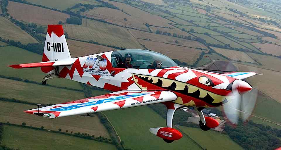 Cloud hopping: Laura in the front of the Extra 300