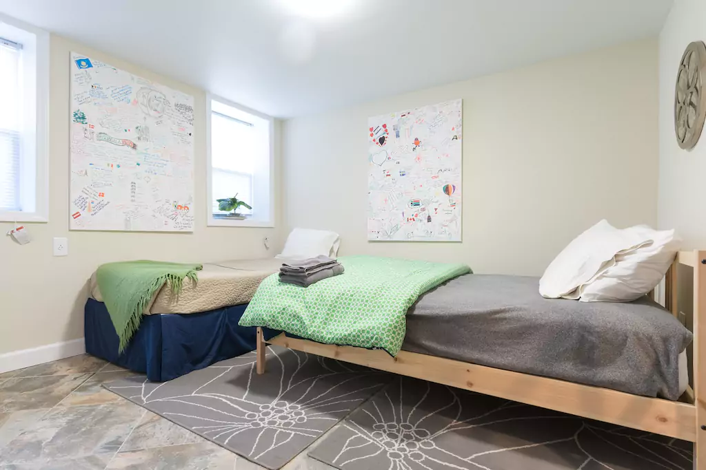 08 Bedroom at back with a full and a twin bed.png