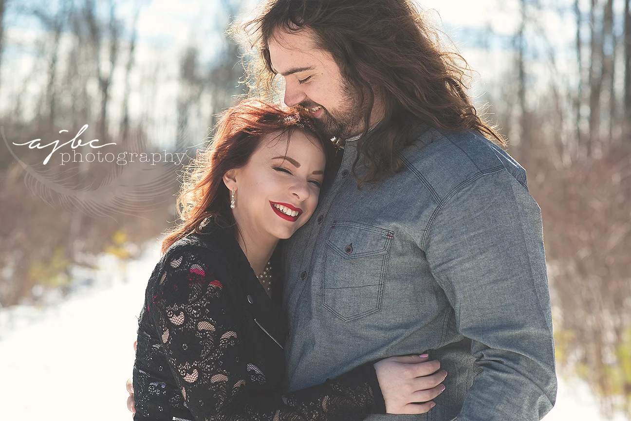 engagement couple in the snow.jpg