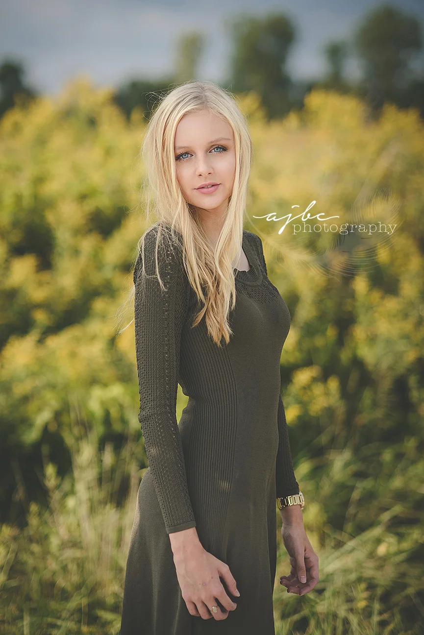senior photos in a field michigan portrait photographer.jpg