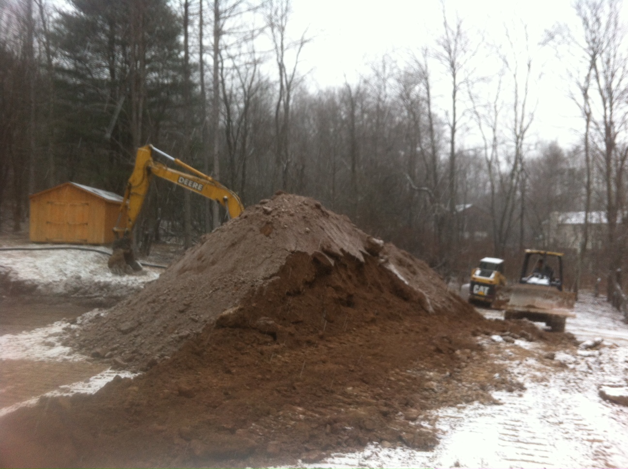 Spreading 1/4" Stone for Prefab Foundation Walls