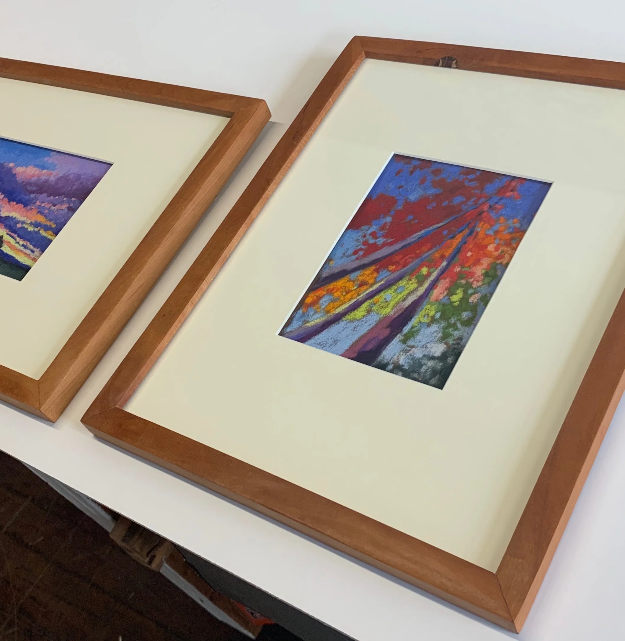 The smaller drawings are framed in thinner stock.