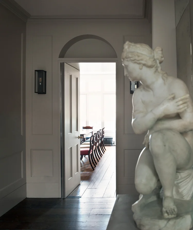 December 2018 The remodelled entrance hall of our recently refurbished villa for an art dealer. The interconnected spaces are defined by new panelling and a Soanian niche announces the entrance to the study. Link to project