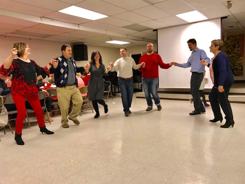 Albanian friends sharing a meal and dancing at a recent Christmas party outreach