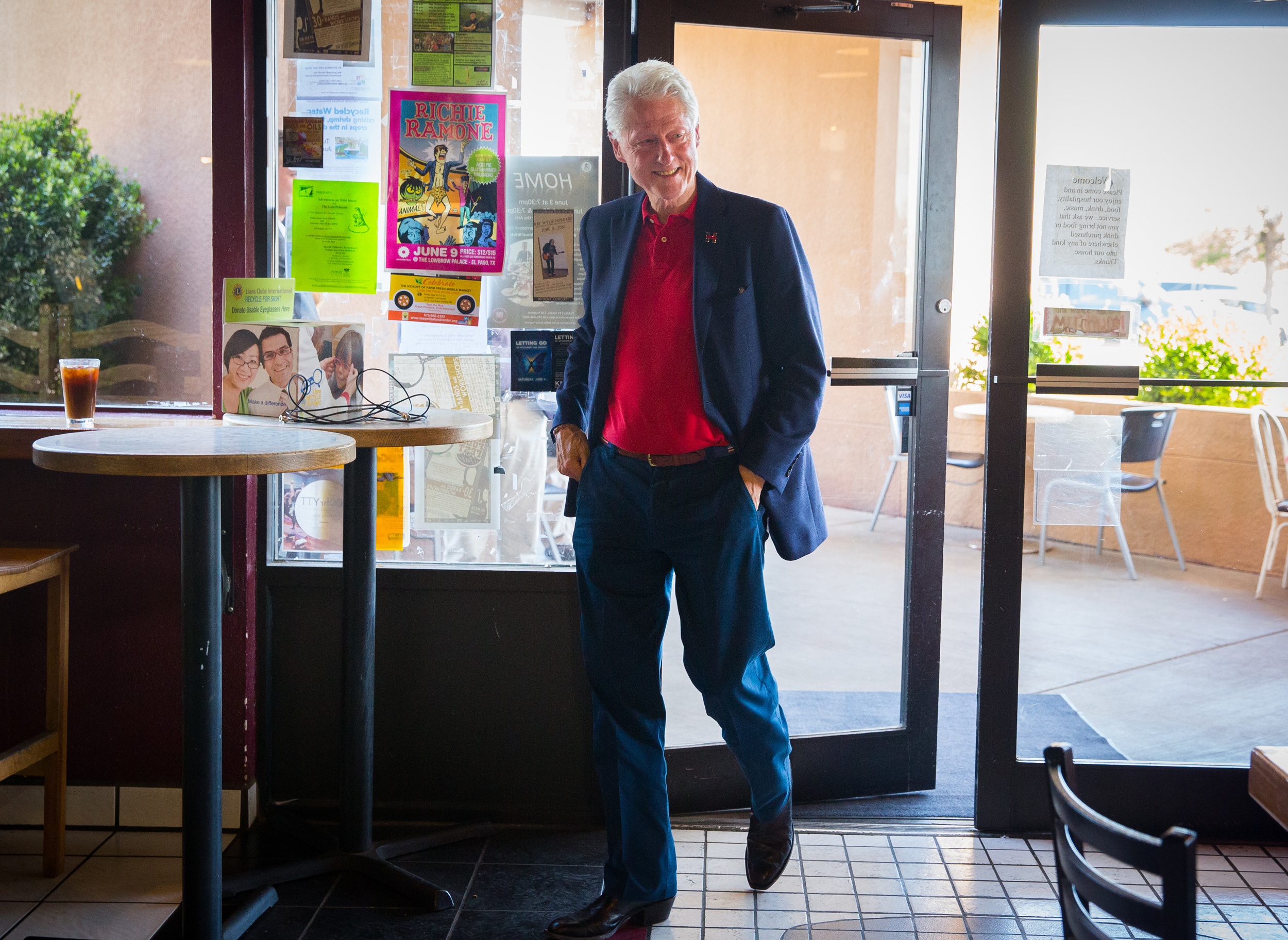 Former United States president Bill Clinton strolls into Cafe Milagro in Las Cruces, NM, to chat with people in the cafe after spending time at Picacho Middle School stumping for his wife, presidential candidate Hillary Clinton, June 2, 2016.
