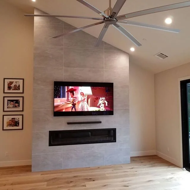 77" OLED @lgusa TV flush mounted on tile with a floating soundbar over a gas fireplace. Not sure if your dream project is possible? Give us a call or shoot us an email. With our many years of experience and skilled custom experts, we turn dreams