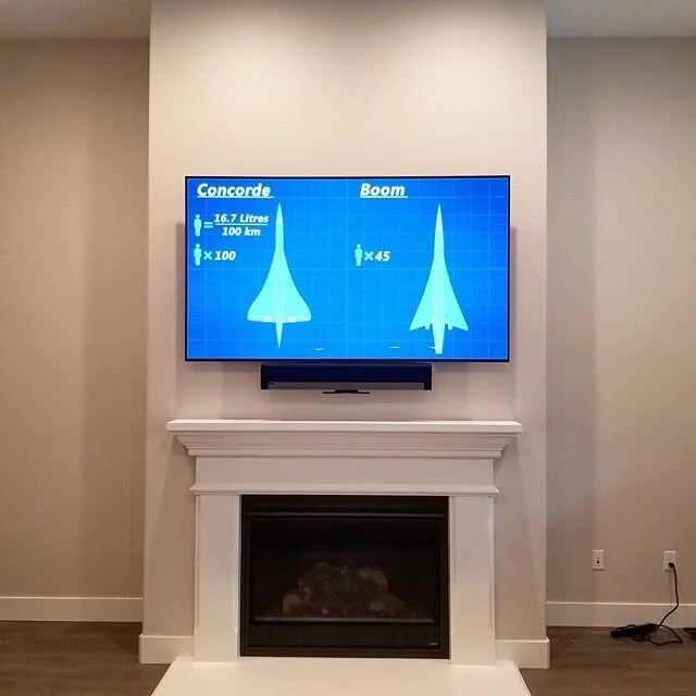77 Inch @lgusa OLED and @sonos PlayBar (with hardwired surrounds mounted over a fireplace using a pull down @mantel_mount. Tired of breaking your neck to watch TV? Dont compromise, put your TV where you want it! Contact us today for a free quote. #ma