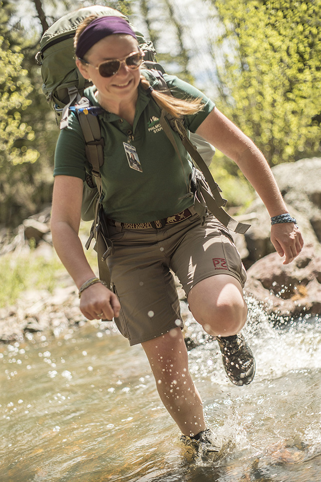 Ranger Trainer Tori Mack gets her boots wet while crossing a stream.