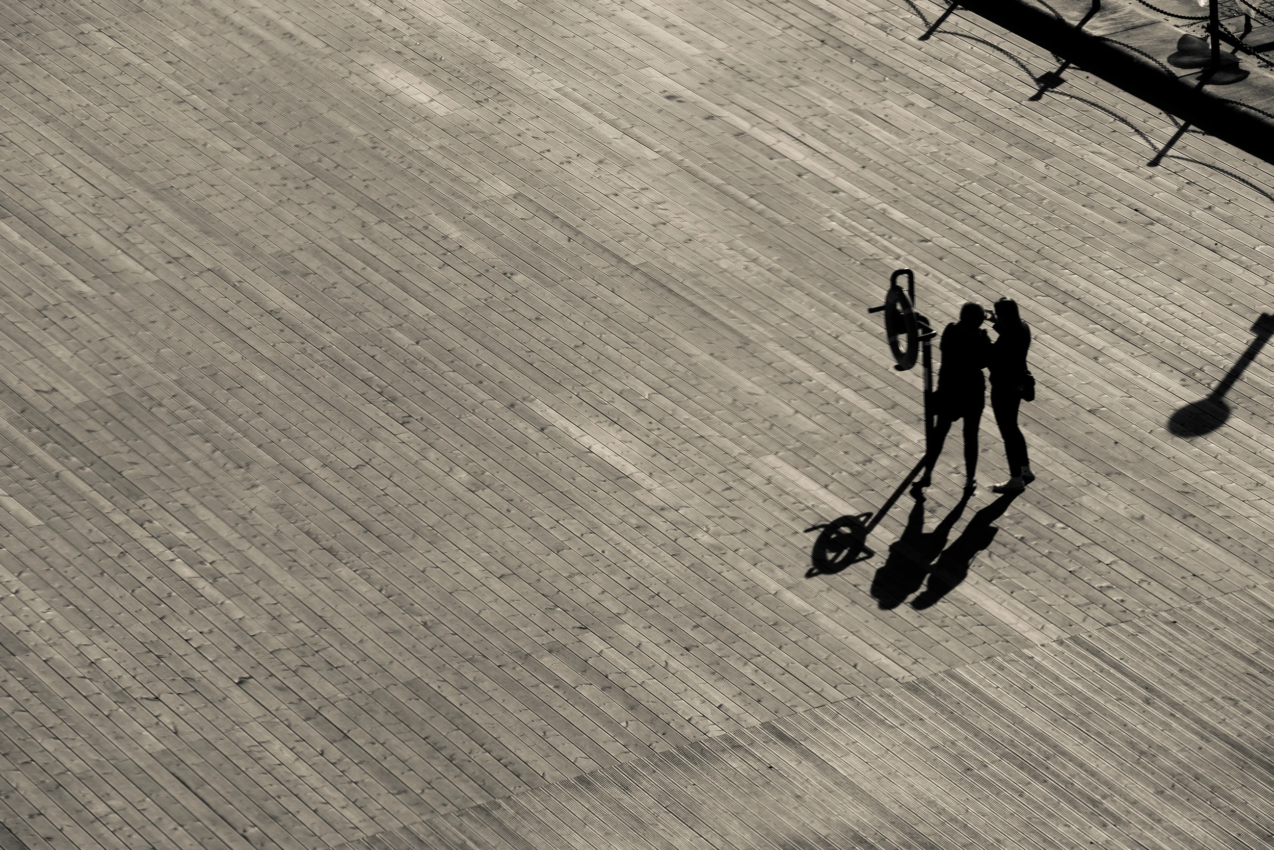 A Selfie Together Let's see: an awesome wooden texture, amazing light, people interacting naturally (and quite narcissistically) and of course, me being a sucker for a silhouette? This picture makes the cut.