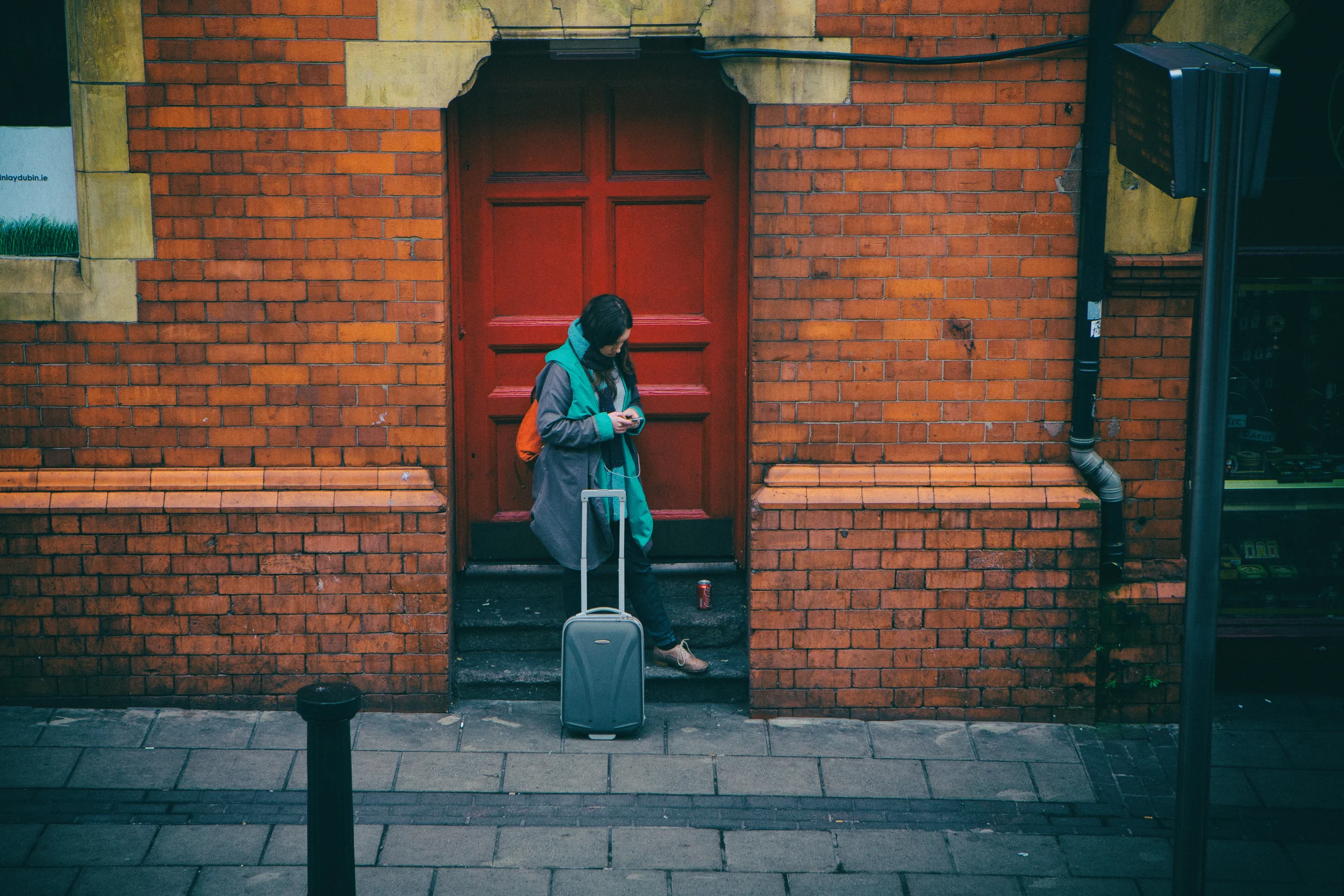 The Center of Attention In this uber weird symmetry of colors, a woman waits for her ride. 