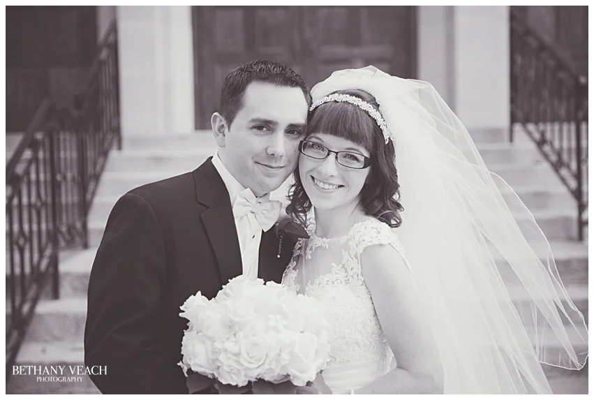 bride and groom smiling