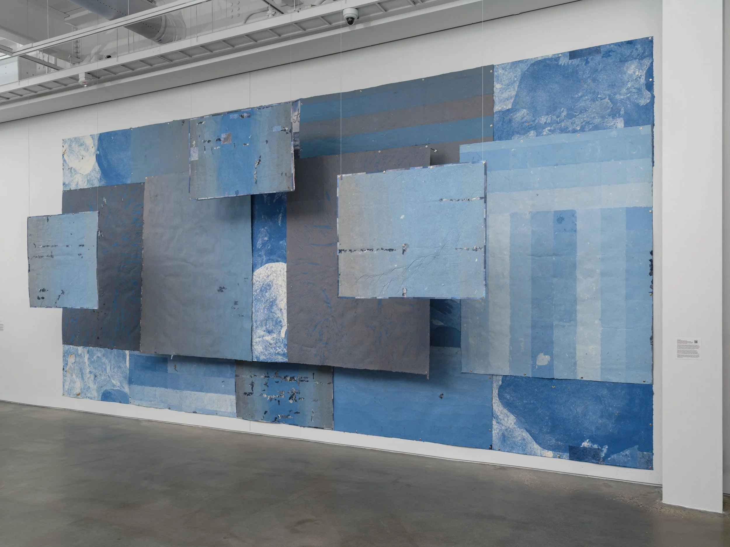    No Mother Tongue  . Materials: Hand-formed paper made with repurposed materials, poems, sun, ink, graphite, thread, hair, rust, rain, acrylic paint, archival prints, fallen foliage the wind carried to the frame, fallen foliage I found on many walk