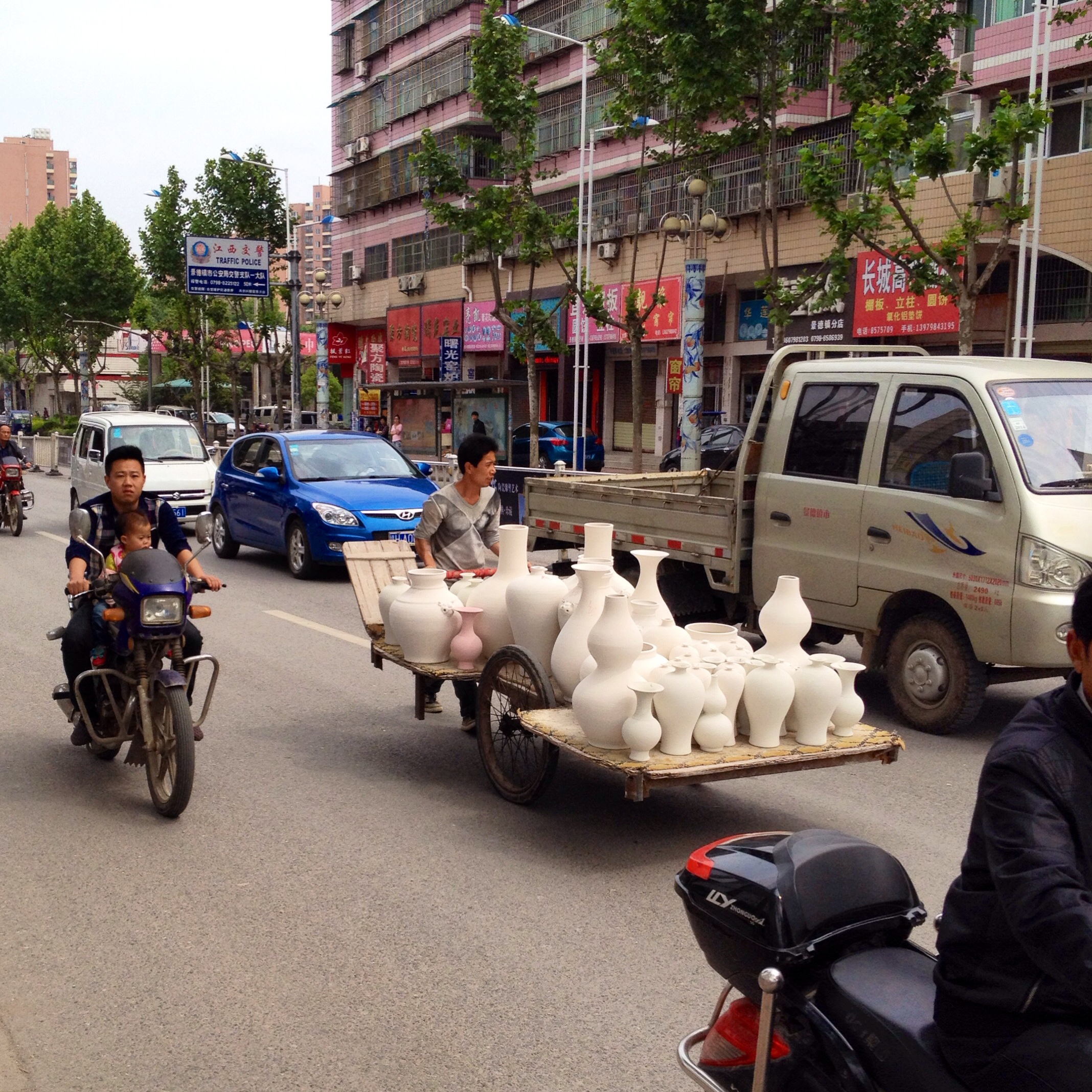 I could not imagine any other place on earth where it would be a common site to see a cart loaded with porcelain being wheeled through the traffic! 