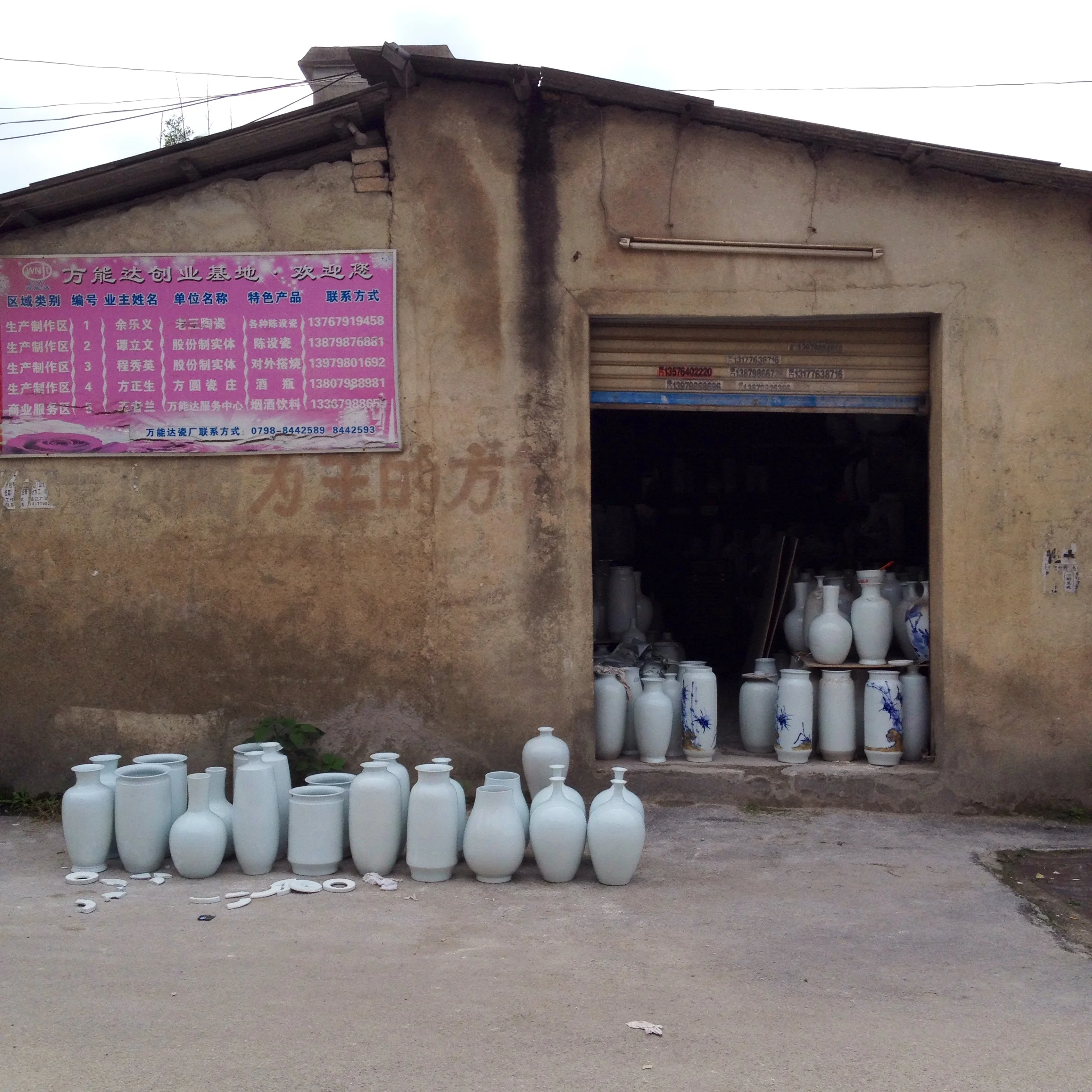 A little shop selling glazed porcelain vases for decoration.