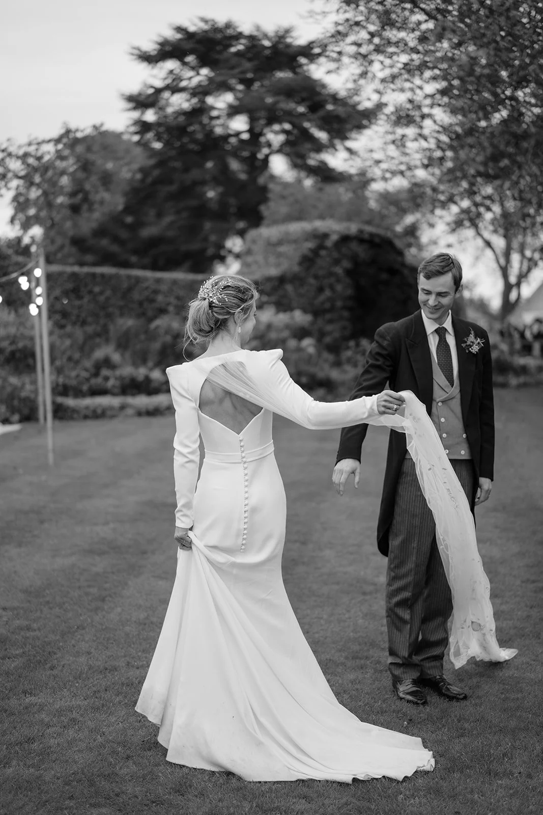 Bride and groom portrait outdoors during their wedding celebration.