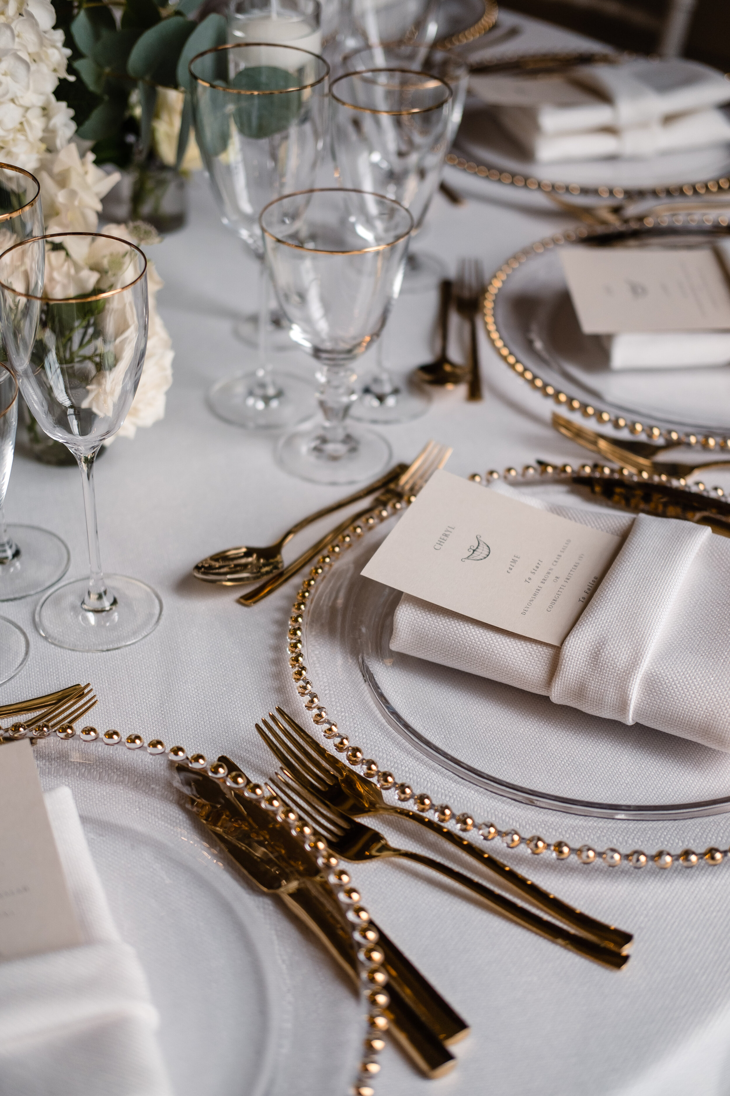 gold cutlery and dinnerware for wedding breakfast