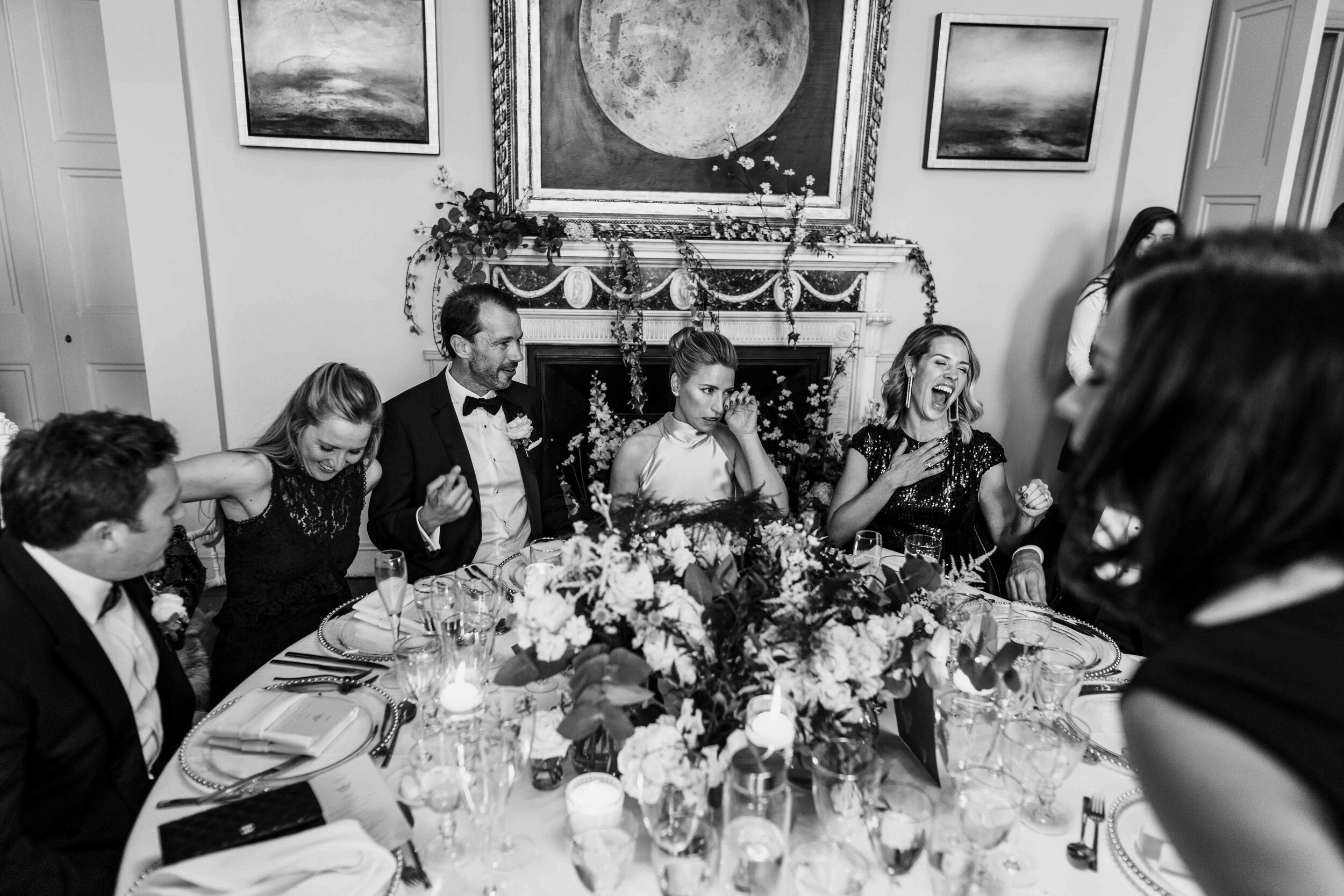 black and white photograph of the top table with wedding guests from above