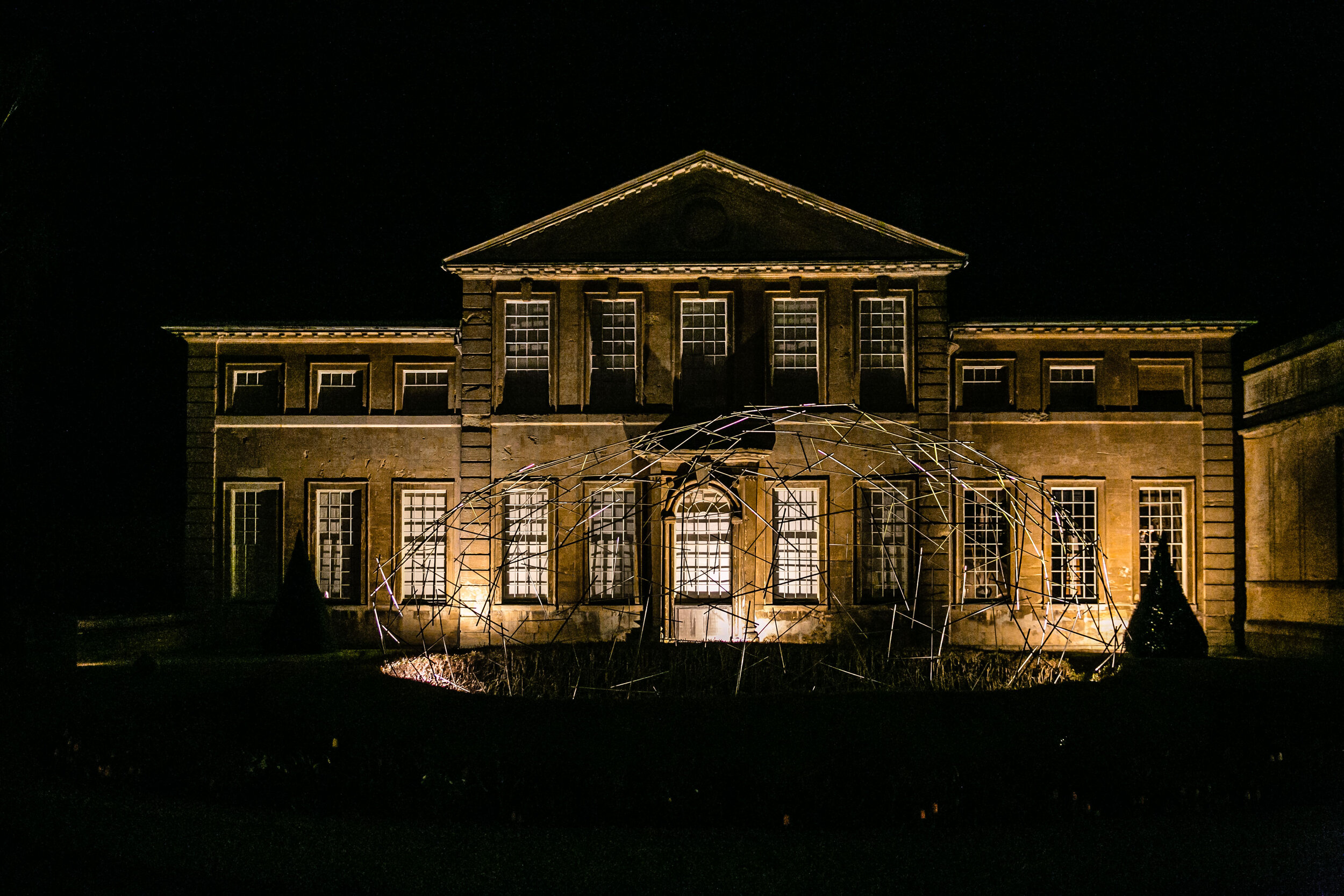 night photograph of Aynhoe Park lit up from outside