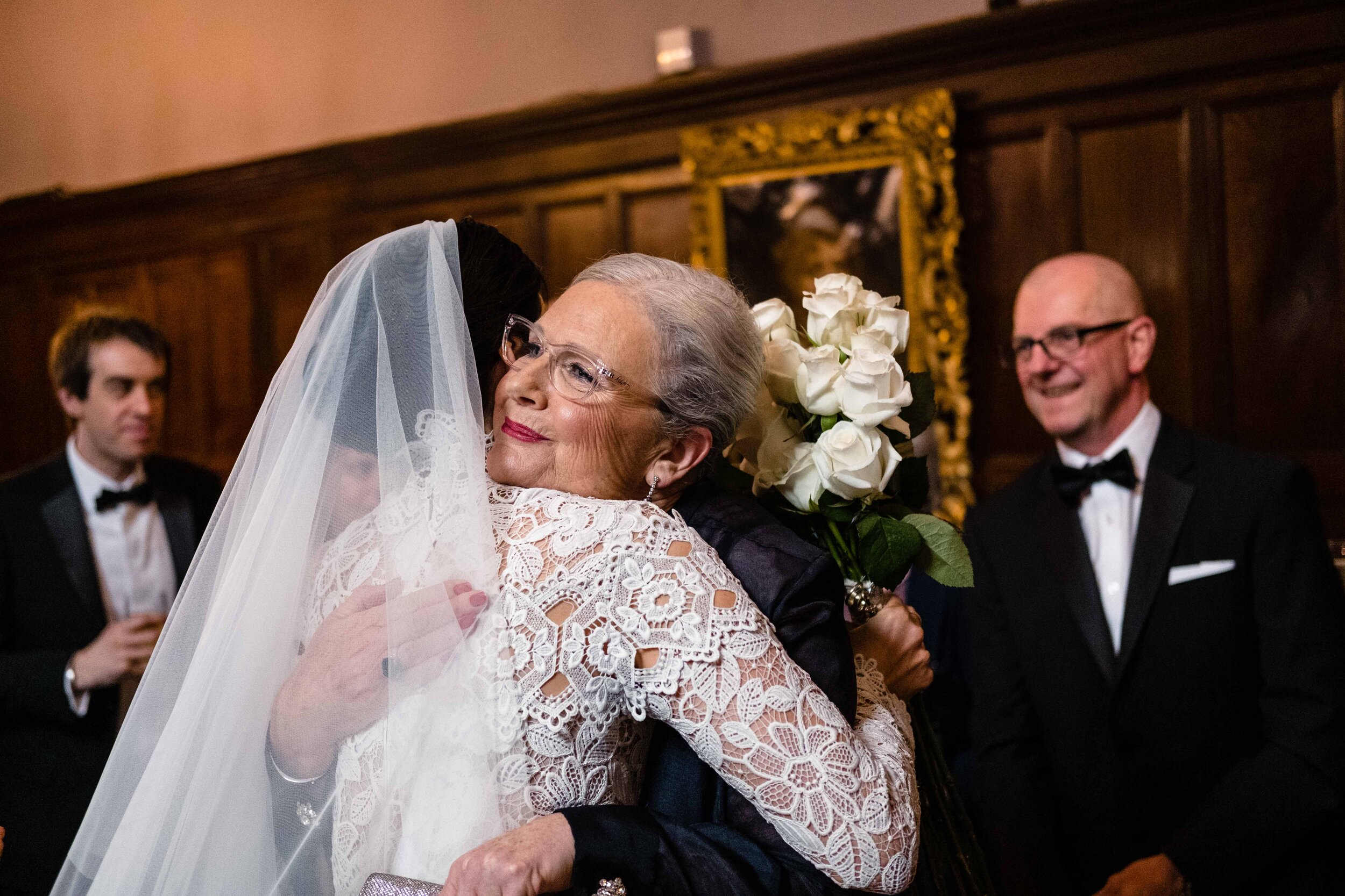 bride hugging mother close up mothers face