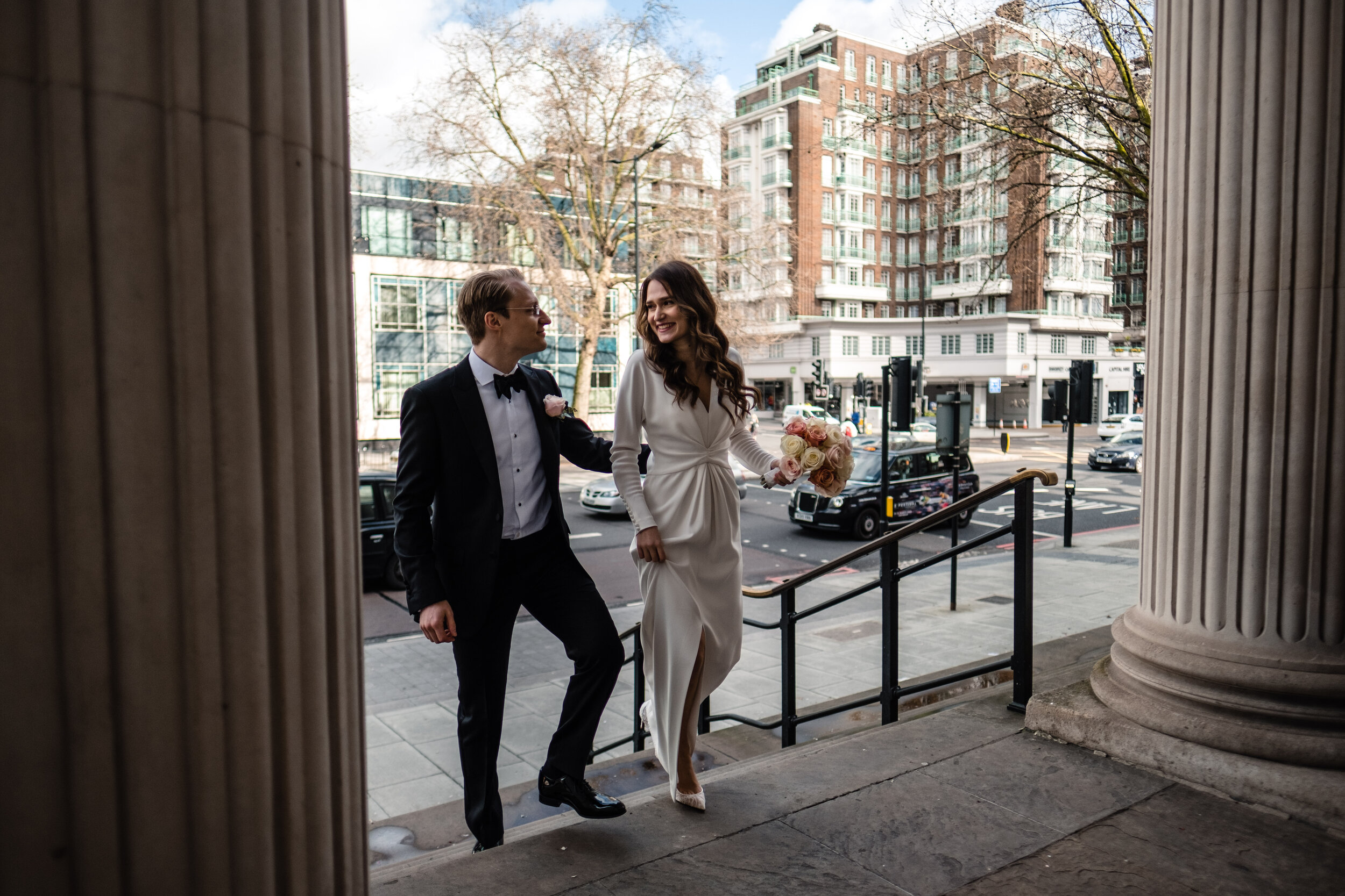 bride and groom arrive at Old Marylebone town hall for marriage