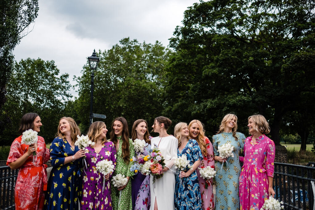 group of bridesmaids in missed matched floral dresses