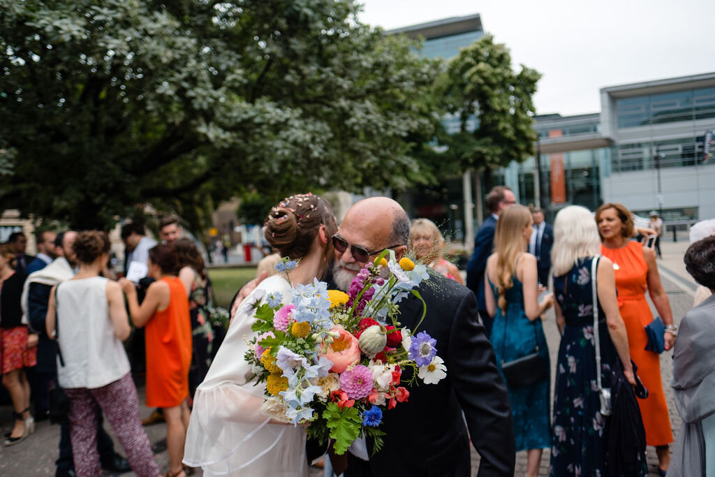 bride hugging older man