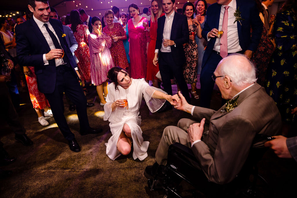 bride dancing with grandfather at wedding