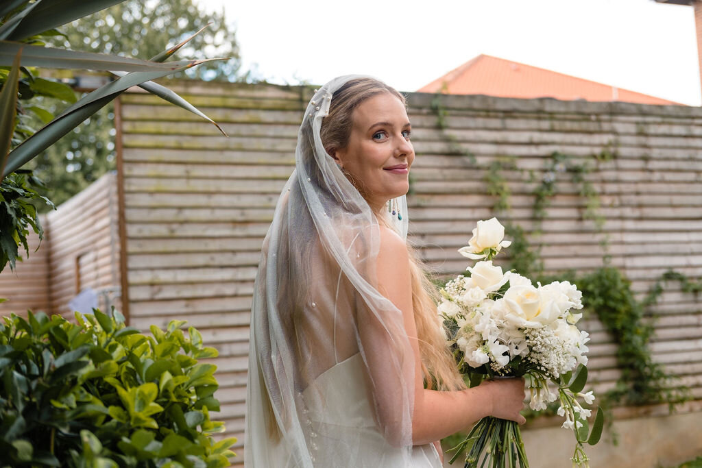 bride looking over shoulder with veil