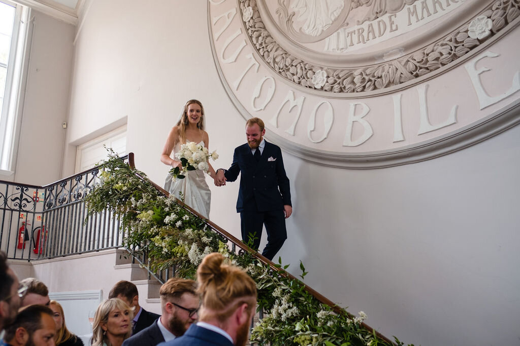 bride and groom walking down steps at sunbeam studios